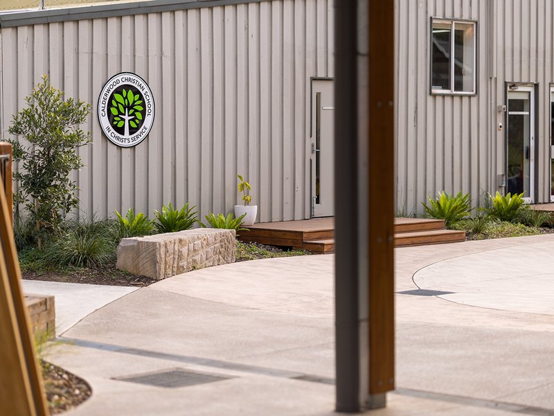 A Calderwood logo sign seen on the side of a building at the school.