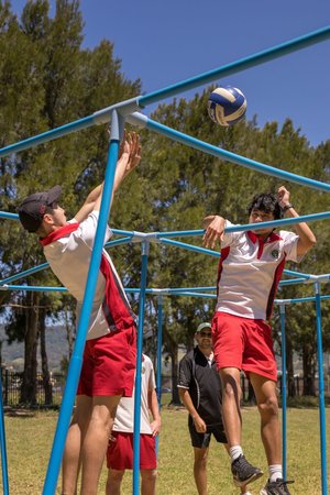 Students playing nine-square outdoors.